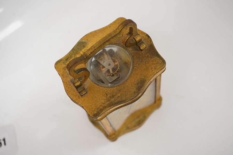 A late 19th / early 20th century ornate French gilt metal cased carriage timepiece, the dial inscribed Henry Birks, with key, 15cm high. Condition - fair, untested